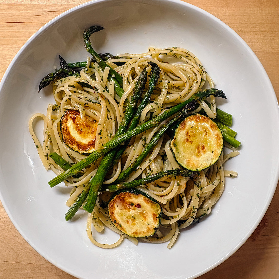 Aglio e Olio pasta made with Pastacraft pasta sauce starter stanley tucci style with zucchini an aparagus